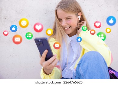 Teenage girl using social media apps on mobile phone - Powered by Shutterstock