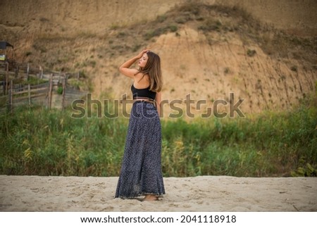 Сute teenage girl or woman on the beach nature landscape fresh air beach. Natural beauty. lifestyle real people, funny, dance.