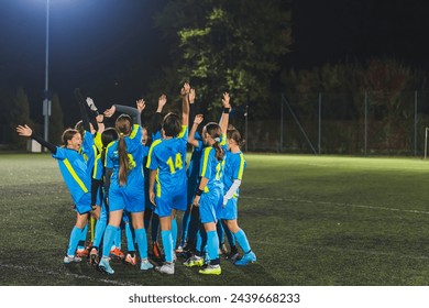 teenage girls football team preparing for match and encouraging each other, blue uniforms, active and sport life. High quality photo - Powered by Shutterstock