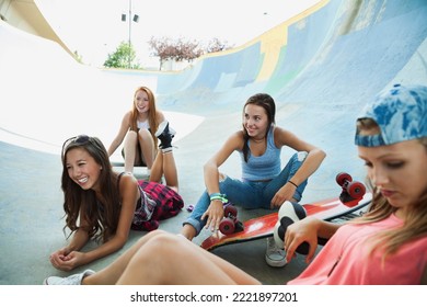 Teenage girls hanging out at skateboard park - Powered by Shutterstock