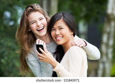 Teenage Girls Reading Text Message Together