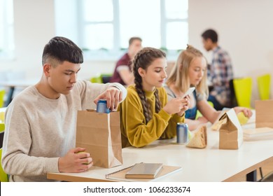 Teenage High School Students At School Cafeteria During Lunch