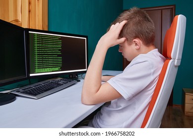 A teenage programmer thinks about the code for solving a computer problem. The programming language code on the monitor screen - Powered by Shutterstock - Get 15% off with code: PIKWIZARD15