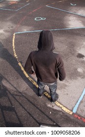 Teenage School Boy In Black Hoodie – Bad Boy Bully - Standing In A Yard