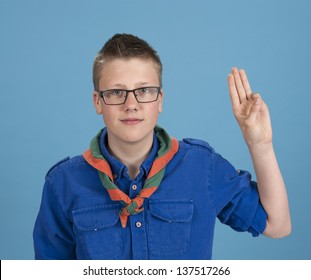 teenage scout boy making an oath - Powered by Shutterstock