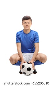Teenage soccer player with a football looking at the camera isolated on white background