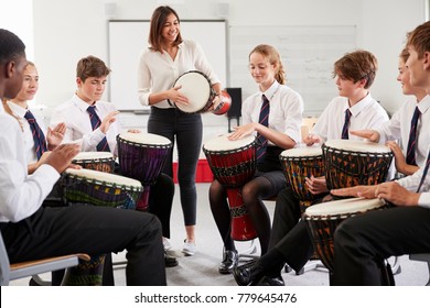 Teenage Students Studying Percussion In Music Class