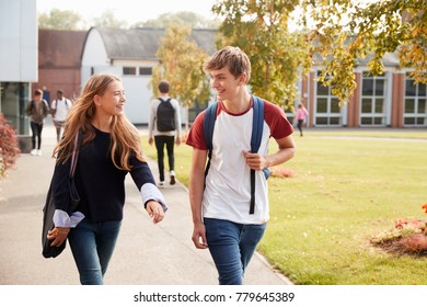 Teenage Students Walking Around College Campus Together - Powered by Shutterstock