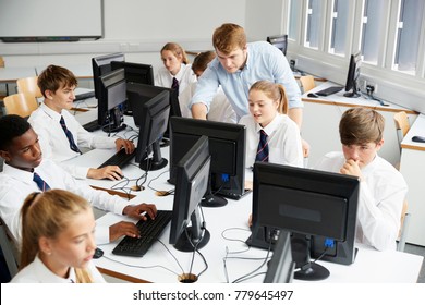 Teenage Students Wearing Uniform Studying In IT Class - Powered by Shutterstock