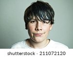 Teenaged boy with greasy hair