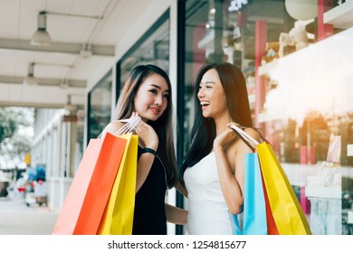 Teenager Asian Women Walking And Doing Shopping Together.