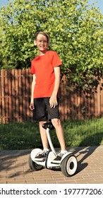 Teenager Blond Boy Moving On Segway 