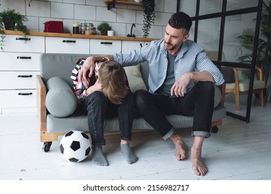 Teenager Boy With A Backpack Disappointed And Sad Because Of Football Game. Dad Supporting Him. Back To School Concept. Cute Brown Pet Dog Around. 