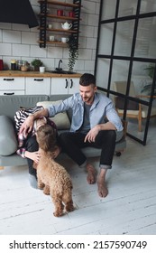 Teenager Boy With A Backpack Disappointed And Sad Because Of Football Game. Dad Supporting Him. Back To School Concept. Cute Brown Pet Dog Around. 