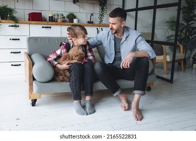 Teenager Boy With A Backpack Disappointed And Sad Because Of Football Game. Dad Supporting Him. Back To School Concept. Cute Brown Pet Dog Around. 