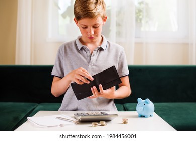 Teenager boy counting money and taking notes. Kids financial education and responsibility, accumulation and savings planning. The child manages and deposits his finance, saves money for a dream - Shutterstock ID 1984456001