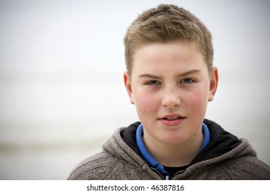 Teenager Boy Looking At Camera In Cold Weather With Sweater Look For More O The Same Model