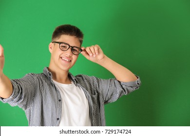 Teenager Boy Taking Selfie On Color Background