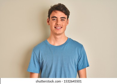 Teenager Boy Wearing Casual T-shirt Standing Over Isolated Background With A Happy And Cool Smile On Face. Lucky Person.