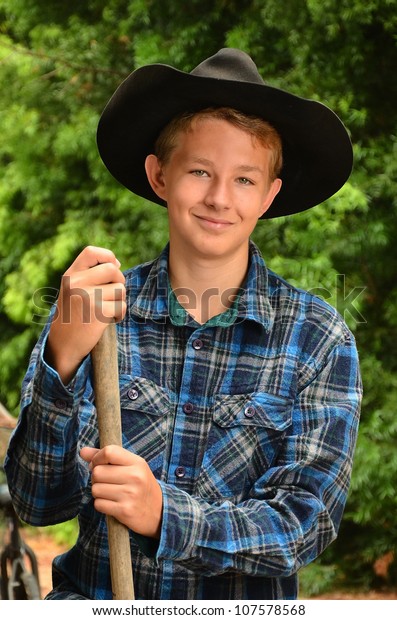 teenager-cowboy-hatyoung-cowboyportrait-young-600w-107578568.jpg
