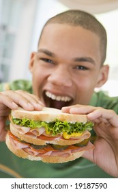 Teenager Eating A Sandwich