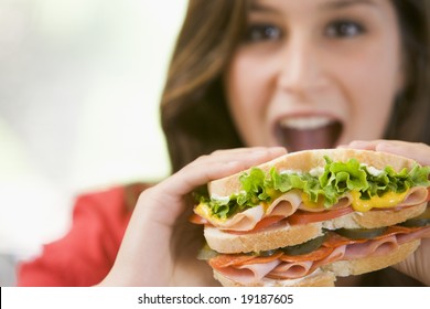 Teenager Eating A Sandwich