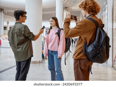 Teenager friends recording interview streaming live video from shopping mall - Powered by Shutterstock