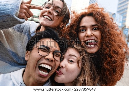 Teenager friends taking self portrait making funny faces. Happy friendship generation z crazy youngsters having fun together