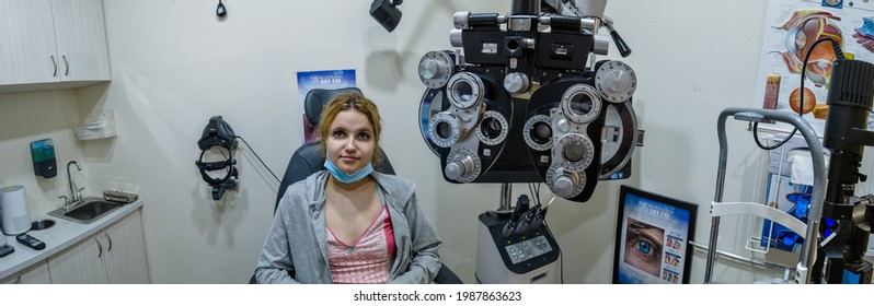 Teenager Girl 14 Years Old In Ophthalmology Office, Equipment Commonly Seen In An Eye Doctor Room, New York, United States, 06.05.2021