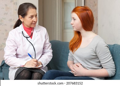 Teenager Girl Complaining  To Doctor About  Abdominal Pain At Hospital