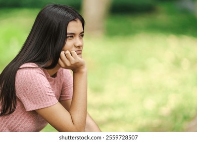 Teenager girl contemplating and meditating in a peaceful garden, enjoying the tranquility of nature - Powered by Shutterstock