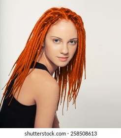 Teenager Girl With Dreadlocks Red Hair And Smiling Studio Portrait 