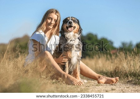 Similar – Attractive smiling blond woman with her two dogs