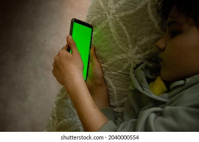 Teenager Girl Holding Phone With Green Screen, Adolescent Girl Using Phone, Modern Digital Technologies