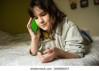 Teenager Girl Holding Phone With Green Screen, Adolescent Girl Using Phone, Modern Digital Technologies