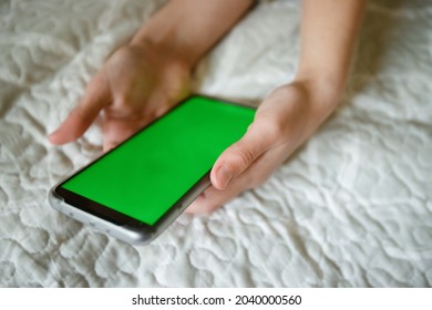 Teenager Girl Holding Phone With Green Screen, Adolescent Girl Using Phone, Modern Digital Technologies