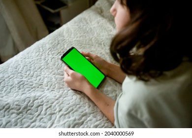 Teenager Girl Holding Phone With Green Screen, Adolescent Girl Using Phone, Modern Digital Technologies