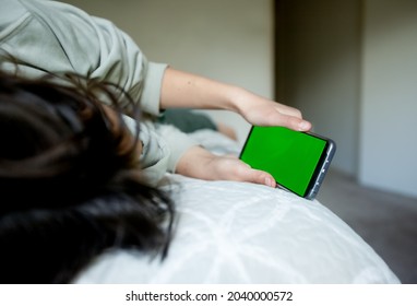 Teenager Girl Holding Phone With Green Screen, Adolescent Girl Using Phone, Modern Digital Technologies