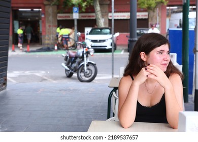 Teenager Girl With Long Dark Hairs And Black Crop Top In Open Air Summer Cafe Close Up Photo. 