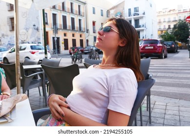 Teenager Girl With Long Dark Hairs And Black Crop Top In Open Air Summer Cafe Close Up Photo. 