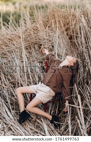 Similar – Image, Stock Photo Blonde girl with hat and hands in the head enjoying relaxed the nature in forest.