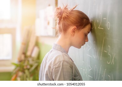Teenager girl in math class overwhelmed by the math formula. Pressure, Education, Success concept.