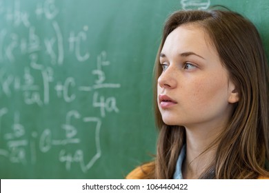 Teenager girl in math class overwhelmed by the math formula. Pressure, Education, Success concept. - Powered by Shutterstock