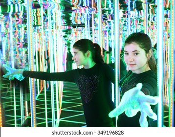 Teenager Girl In Mirror Labyrinth Try To Find The Way Out