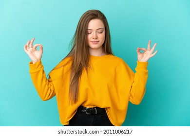 Teenager Girl Over Isolated Blue Background In Zen Pose