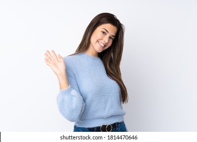 Teenager Girl Over Isolated White Background Saluting With Hand With Happy Expression