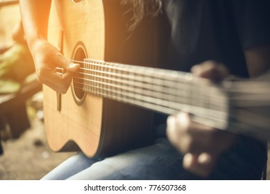 Teenager Girl Playing Guitar On Happy Time