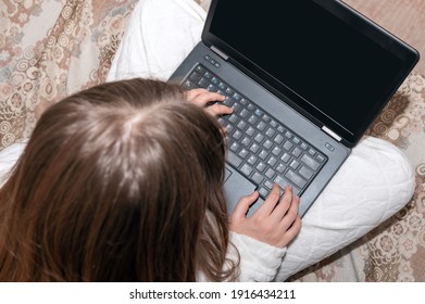 Teenager Girl Studying Online At Home Looking At Laptop. Top View. Online School. Home Schooling. 