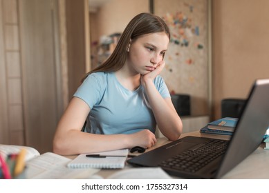 teenager girl is upset sad, tired, problem is not understanding denial, a poor mark in exam, difficult task equalization, electronic education at home using a laptop on Internet. Fatigue after class