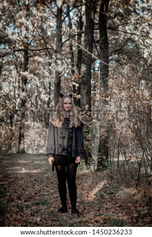 Similar – ein Mädchen mit langen Haaren und blauen Augen in den Bergen, das mit einer Kapuze lächelt